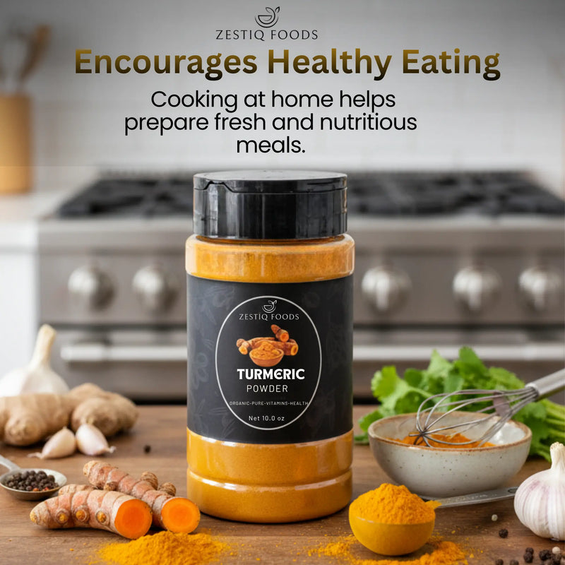 Organic turmeric powder in a bowl with fresh turmeric roots
